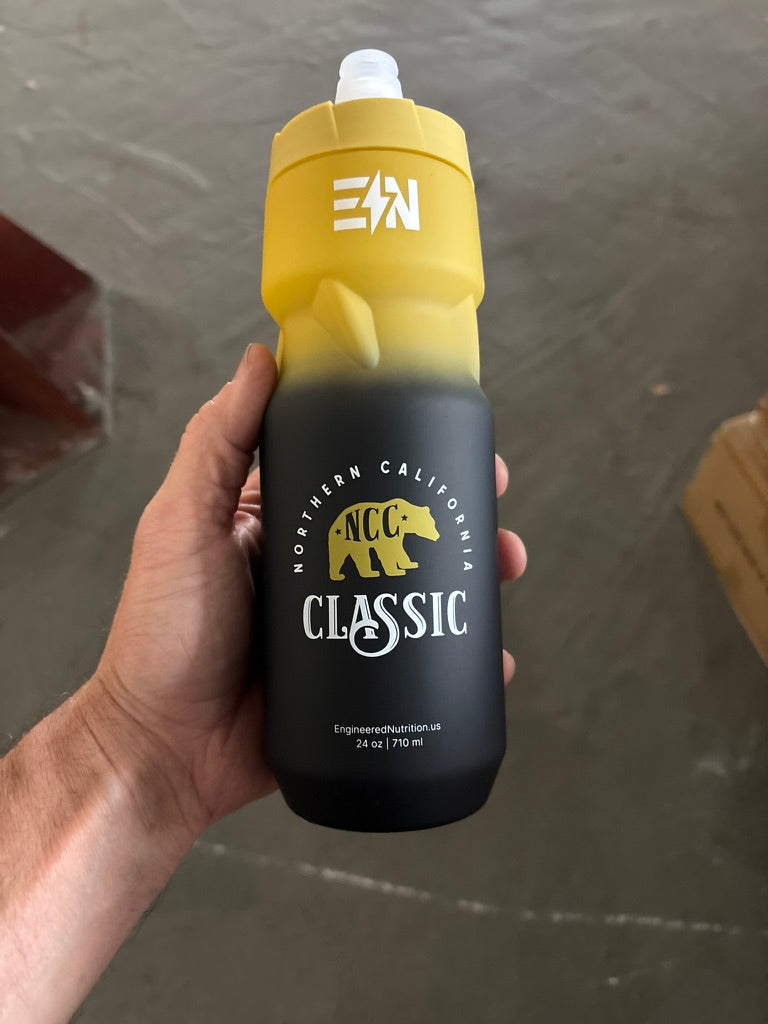 NorCal Classic 2026 Water Bottle held in hand — athlete using the squeeze bottle
